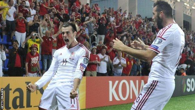 Gareth Bale celebrates with team-mate Joe Ledley after scoring against Andorra