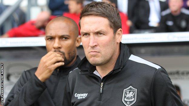 Danny Gabbidon (background) and Scott Young look on as Cardiff tackle Derby