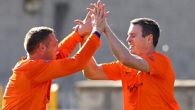 Glenavon defender Kris Lindsay congratulates Kevin Braniff after his goal gives Glenavon a 1-0 victory over Linfield