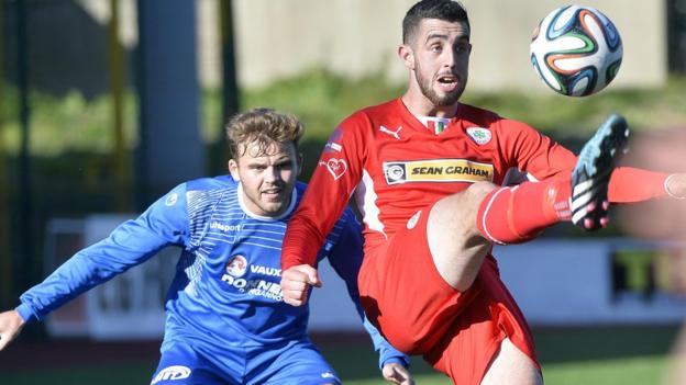 Fra Brennan closes in on Reds striker Joe Gormley, who put Cliftonville ahead in the 1-1 draw