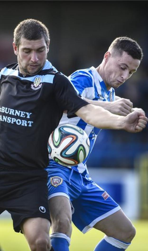 Ballymena forward Matthew Tipton and Coleraine midfielder Ruairi Harkin battle for possession in the derby clash