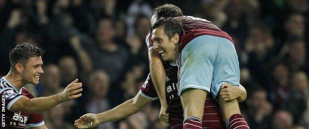 Aaron Cresswell (left), Stewart Downing (centre) and Mark Noble celebrate Downing's goal against Liverpool