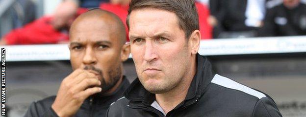 Danny Gabbidon (background) and Scott Young look on as Cardiff tackle Derby