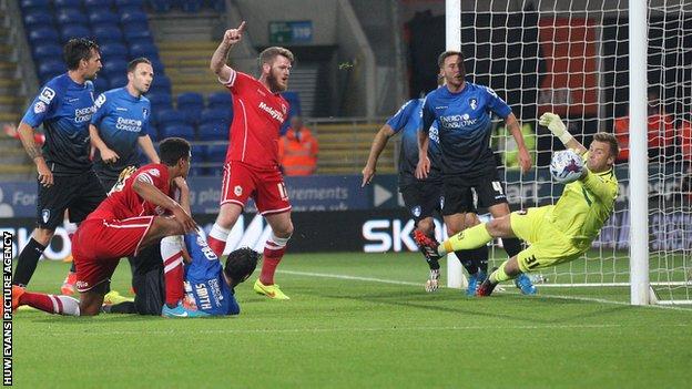 Bournemouth goalkeeper Artur Boruc denies Cardiff City's Tom Adeyemi
