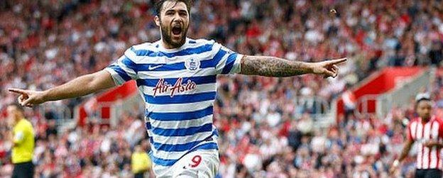 Charlie Austin celebrates scoring QPR's first goal away from home