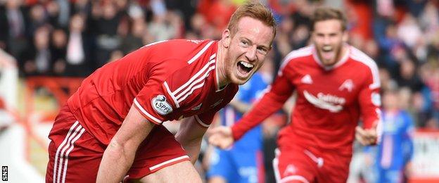 Adam Rooney celebrates after equalising for Aberdeen