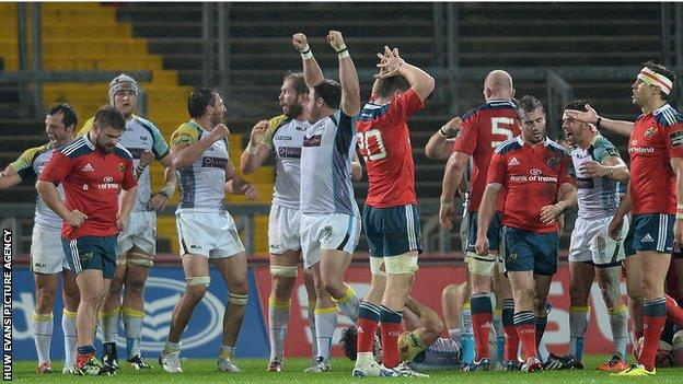 Ospreys players celebrate victory after the final whistle at Thomond Park