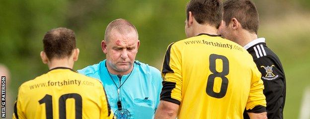 Referee Robert Baxter was unable to continue after being struck by the ball as Oban faced Fort William.