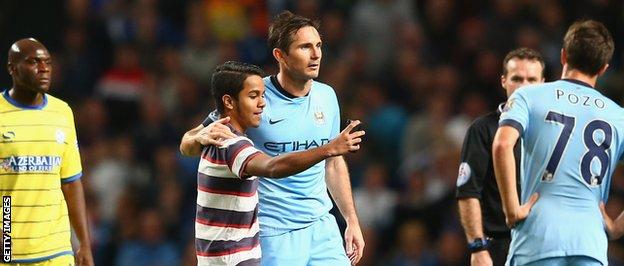 Frank Lampard is snapped in a selfie by a pitch invader during his side's 7-0 win over Sheffield Wednesday