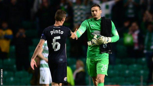 Celtic goalkeeper Craig Gordon and Dinamo Zagreb's Ivo Pinto shake hands