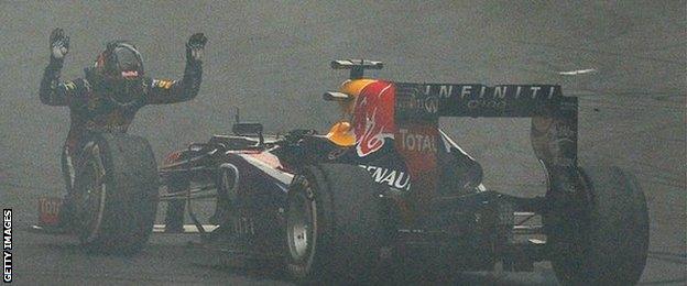 Sebastian Vettel bows to his car