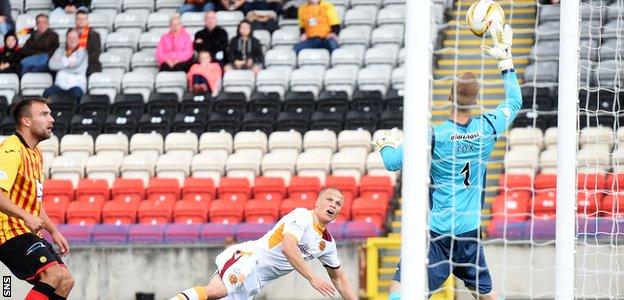 Motherwell's Henrik Ojamaa nods the ball against the bar with his side's best first-half chance