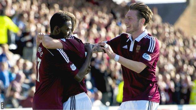 The Hearts players congratulate Prince Buaben on scoring the team's second