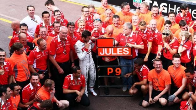 Jules Bianchi celebrates with his team following his 9th place finish at the Monaco Grand Prix.