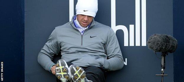 Rory McIlroy waits to play the 17th