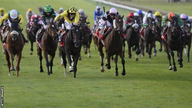 Big Easy (centre, yellow) wins the Cesarewitch