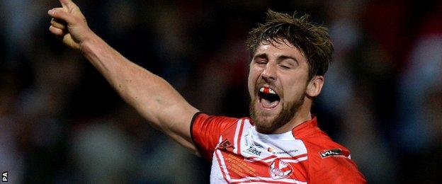 Tommy Makinson celebrates his try