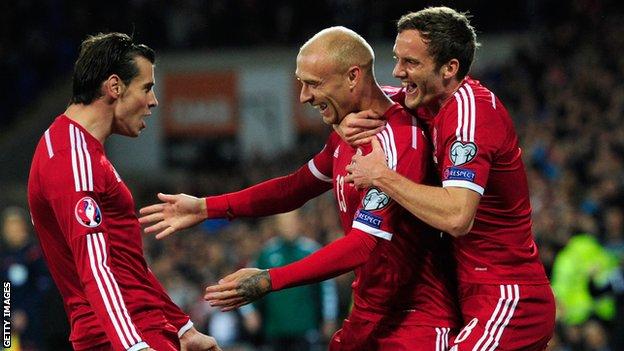 David Cotterill (centre) celebrates his goal with Gareth Bale and Andy King