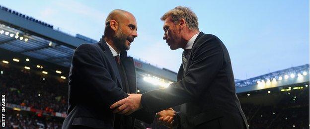 Pep Guardiola and former Manchester United manager David Moyes at Old Trafford, April 2014