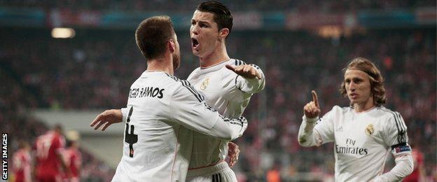Real Madrid's Sergio Ramos, Cristiano Ronaldo and Luka Modric celebrate at the Allianz Arena, 29 April 2014