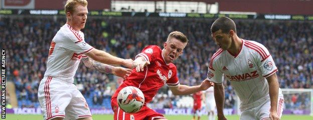 Cardiff’s Craig Noone battles with Forest’s former Bluebirds midfielder Chris Burke