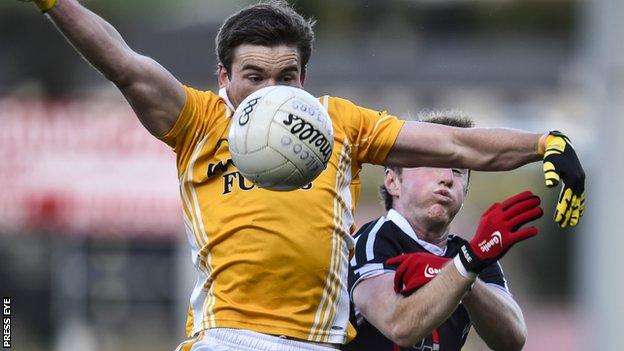 Clontibret's Dessie Mone gets to the ball ahead of Conor Laverty of Kilcoo