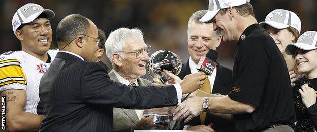 Steelers head coach Bill Cowher gives the Vince Lombardi trophy to team owner Dan Rooney after winning Super Bowl XL between the Pittsburgh Steelers and Seattle Seahawks