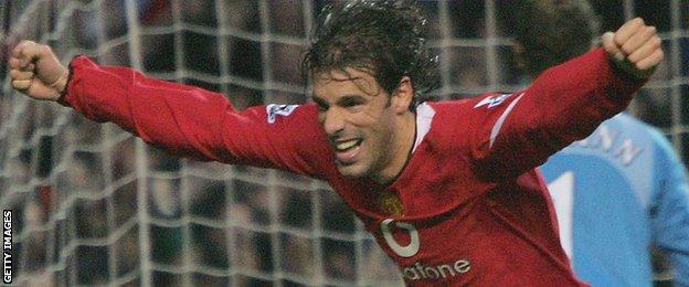 Ruud Van Nistelrooy peels away in celebration after scoring from the penalty spot against Arsenal