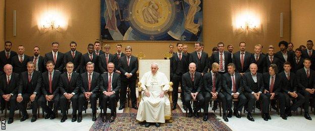 Bayern Munich players presented Pope Francis with a signed shirt during a private audience on Wednesday