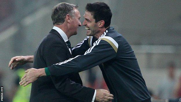 Michael O'Neill and Kyle Lafferty embrace after Northern Ireland's win in Athens
