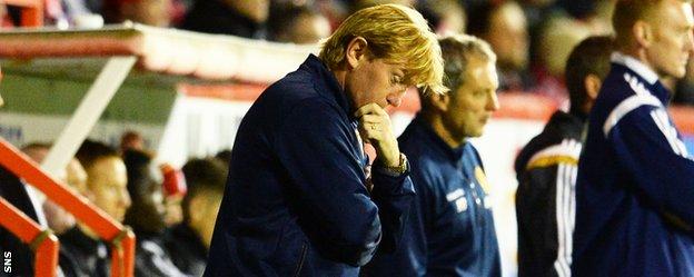 Motherwell manager Stuart McCall looks pensive in the dugout