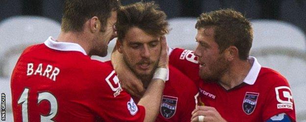 Graham Carey (centre) scored against his former team