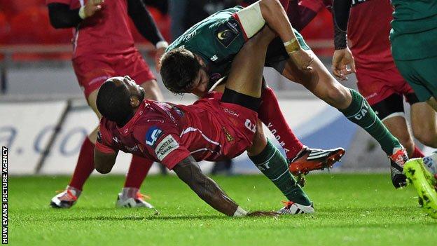 Bruising tackle in the match between Scarlets and Leicester