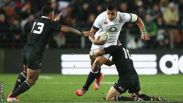 Luther Burrell is tackled by Aaron Cruden