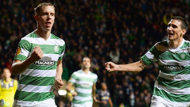 Stefan Johansen (left) celebrates scoring for Celtic