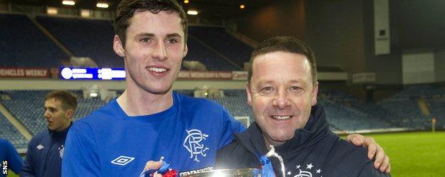 Tommy Wilson with Jordan Wilson after Rangers won the reserve league title in 2013