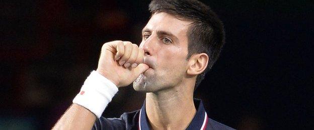 Novak Djokovic celebrates winning the Paris Masters