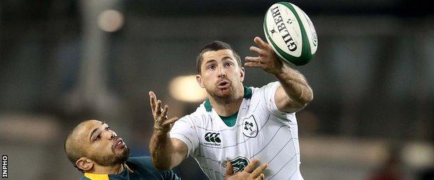 Rob Kearney battles for possession with Bryan Habana