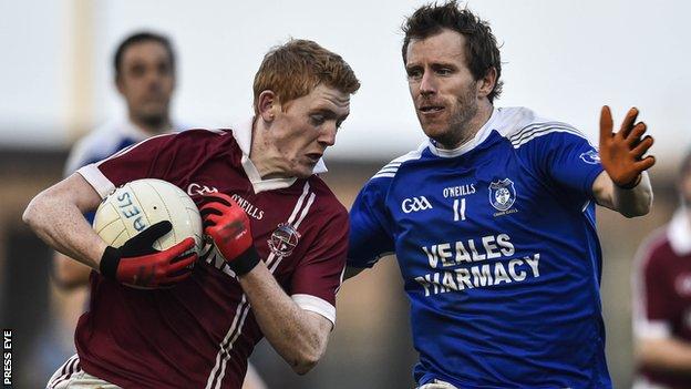 Christopher Bradley, who scored three of Slaughtneil's points, attempts to get past Cavan Gaels forward Michael Lyng