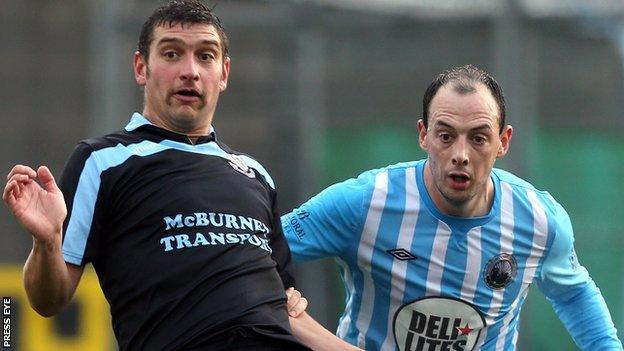 Matt Tipton of Ballymena United in action against Warrenpoint Town's Johnny Cowan
