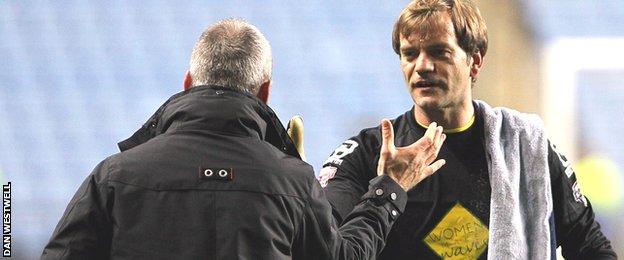 Notts County goalkeeper Roy Carroll (right) is congratulated by manager Shaun Derry after the win over Coventry