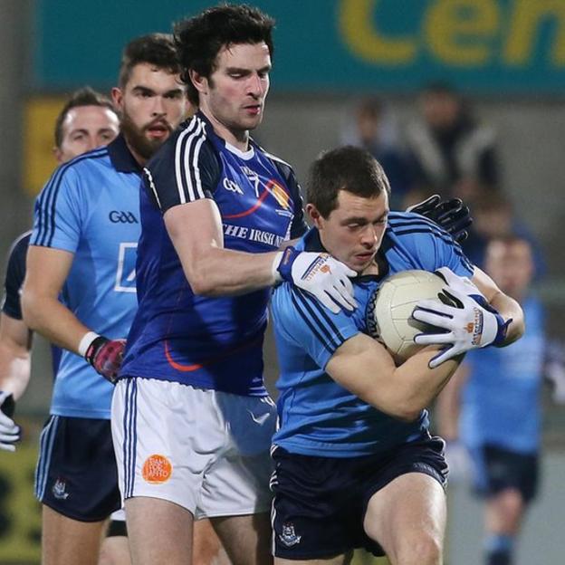 Ulster player Aaron Findon in action against Dublin's Dean Rock