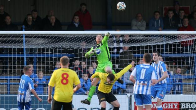 Coleraine keeper Michael Doherty punches clear in the Showgrounds game against Dungannon Swifts