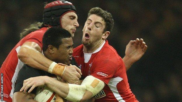 Luke Charteris and Alex Cuthbert tackle New Zealand's Julian Savea in November, 2012
