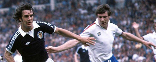 Joe Jordan in action for Scotland