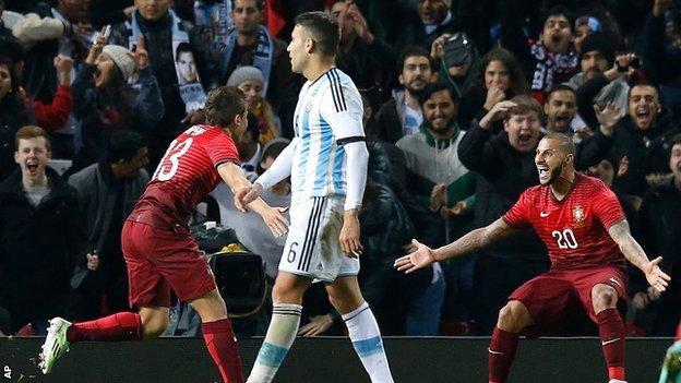 Ricardo Queresma and Raphael Guerreiro celebrate Portugal's winner against Argentina