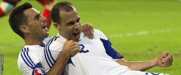 Israel's forward Omer Damari (right)celebrates scoring against Bosnia-Hercegovina