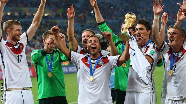 Germany players hold the World Cup trophy aloft