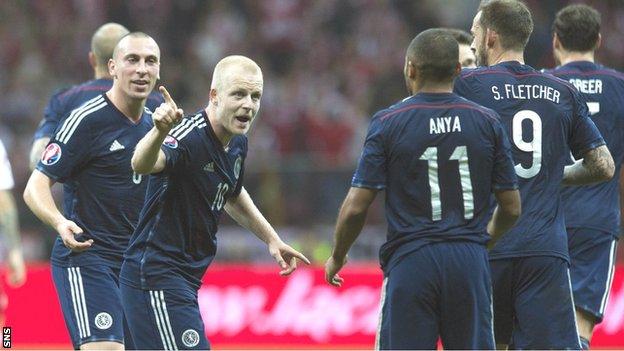 Steven Naismith celebrates scoring against Scotland with Ikechi Anya