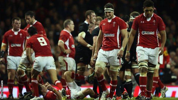 Wales players including captain Sam Warburton (second right) and Taulupe Faletau (right) are left dejected by against New Zealand in 2012